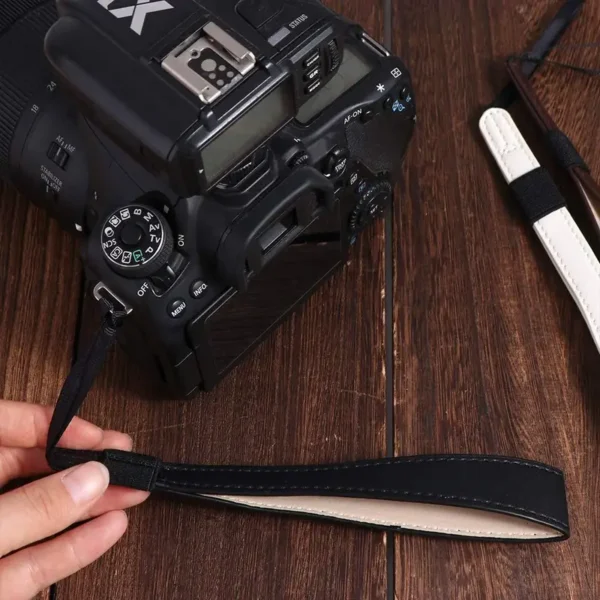 4be73aa536eb4ad39a9f603433611a0b-goods Faux Leather Wristband Camera Strap